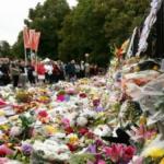People lay flowers at a memorial for the mosque attack victims on Sunday in Christchurch, New Zealand.