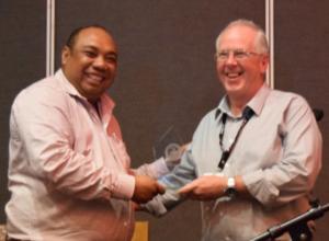 Hon. Jalta Wong MP PNG Minister of Police presents AARC Systems' Richard Wilson with the 2019 PNG Security Congress Award - Best Product on Show