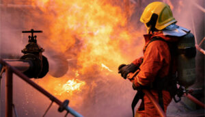 Firefighter combating fire